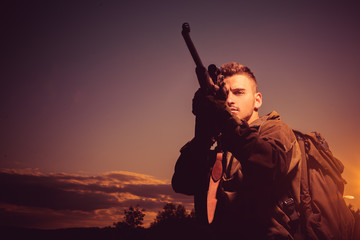 Barrel of a gun. Hunter with shotgun gun on hunt. Hunter with Powerful Rifle with Scope Spotting...
