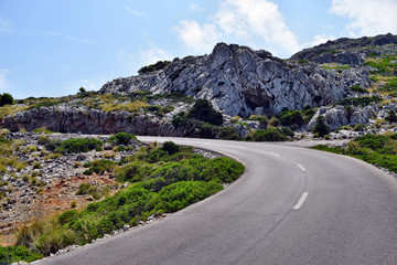 Open coastal road winding through to lighthouse Cap Formentor