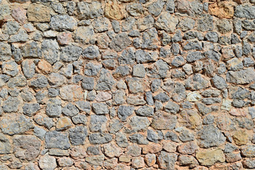 Fototapeta premium Stone wall closeup background