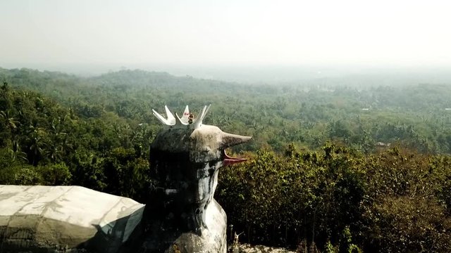 Drone flying over the chicken church, Gereja Ajam in Java, Indonesia, with a model.