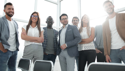 boss and business team standing in bright office