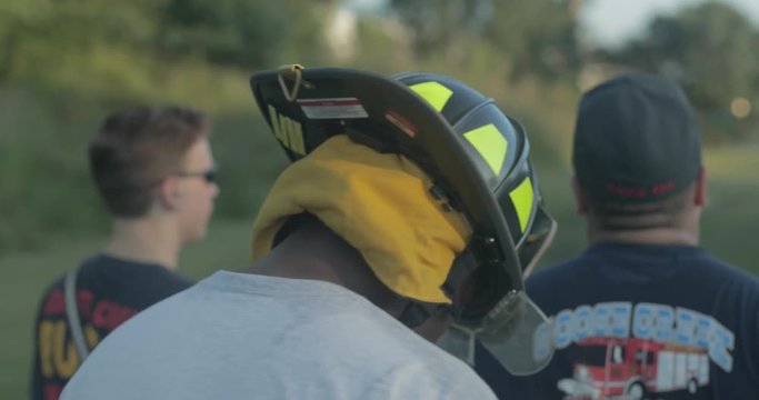 Firefighters walk back to fire engine