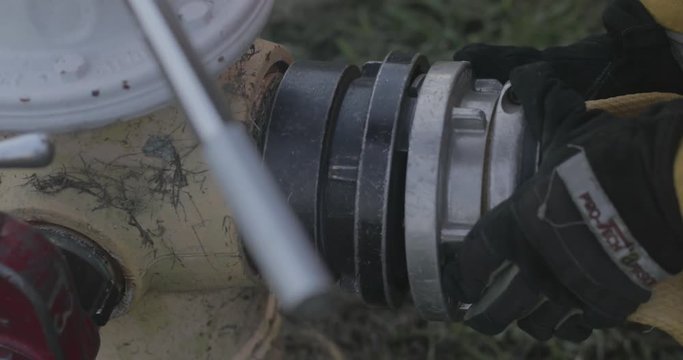 Firefighter uses fire hydrant
