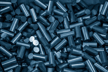 The  heap of raw material rod in the light blue scene.Material for manufacturing process.
