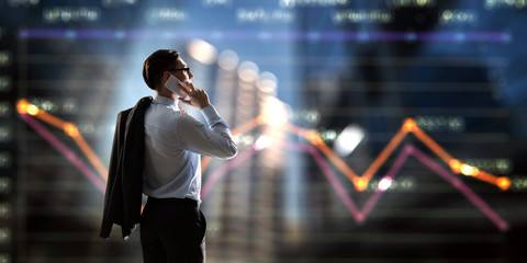 Businessman having mobile talk © Sergey Nivens