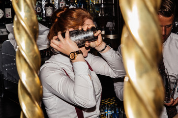 Female Bartender Shaking a Cocktail