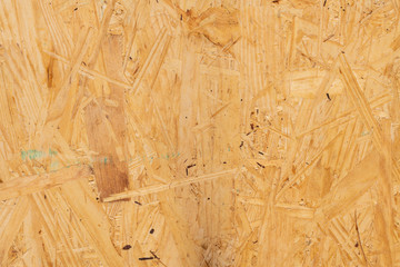 Close up of sub flooring board made of wood chips background