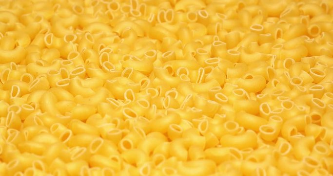 C4K closeup shot of the dry Lumachine pasta on a rotating stand