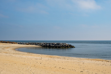 man made beach with stone breakwater