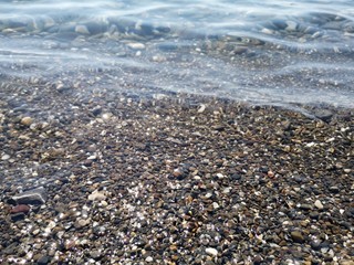 Sand and waves on the black sea.