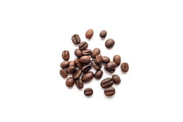 Roasted coffee beans isolated on white background. Close-up.