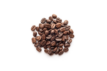 Roasted coffee beans isolated on white background. Close-up.