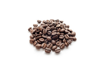 Roasted coffee beans isolated on white background. Close-up.