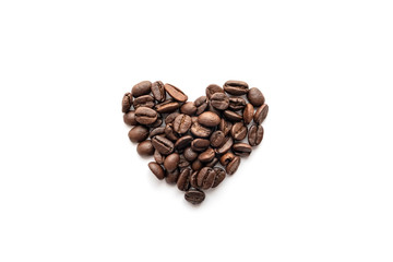 Heart shape of roasted coffee beans isolated on a white background.