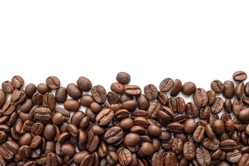 Roasted coffee beans on white background. Close-up.