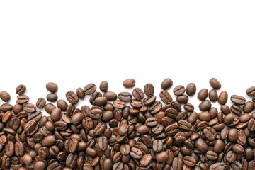Roasted coffee beans on white background. Close-up.