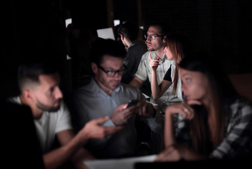 business team uses gadgets to get the information they need