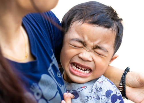 Thai naugthy boy gotta crying in his mom warm hug.