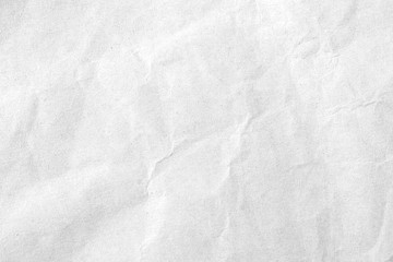 Fototapeta na wymiar White crumpled paper texture background. Close-up.
