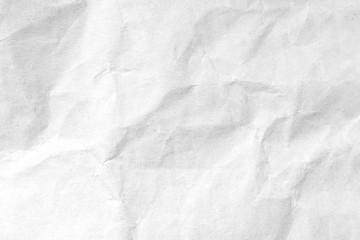 Fototapeta premium White crumpled paper texture background. Close-up.