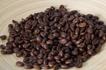Coffee beans in bamboo Cup close-up