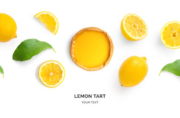 Creative layout made of lemon tart and lemons on white background. Flat lay. Food concept.
