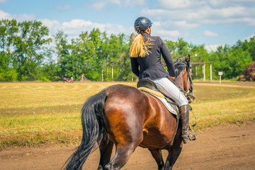 Russia, Samara, August, 2018: Equestrian sport (dressage, passage) - a young girl on a horse