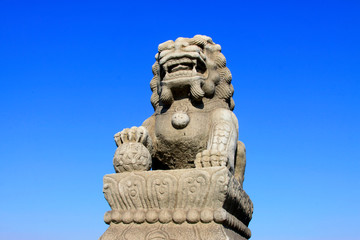 Fototapeta premium stone lion on bridge railing, China