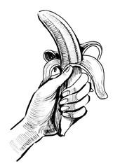 Hand holding a banana