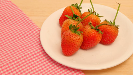 Strawberry on wood table and space for write wording, sweet romantic fruit for special person in special days, lovers in Valentine day, make many dessert menu or juice or dairy strawberry flavor
