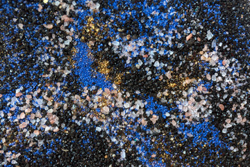 Layered colorful sand pattern. Marble style background. Blue and gold powder texture.