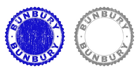 Grunge BUNBURY stamp seals isolated on a white background. Rosette seals with distress texture in blue and grey colors. Vector rubber overlay of BUNBURY text inside round rosette.