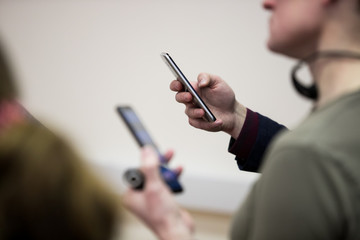 Close up of a man using mobile smart phone