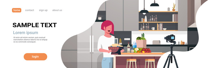 girl food blogger recording video on camera woman preparing tasty dish modern kitchen interior cooking blog concept female character portrait flat copy space horizontal