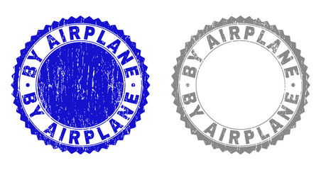 Grunge BY AIRPLANE stamp seals isolated on a white background. Rosette seals with grunge texture in blue and gray colors. Vector rubber watermark of BY AIRPLANE tag inside round rosette.