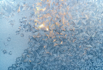 Ice pattern on winter glass, closeup natural texture