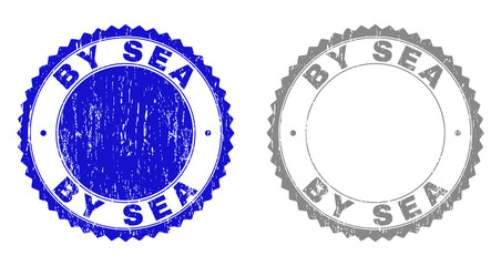 Grunge BY SEA stamp seals isolated on a white background. Rosette seals with grunge texture in blue and gray colors. Vector rubber imprint of BY SEA tag inside round rosette.