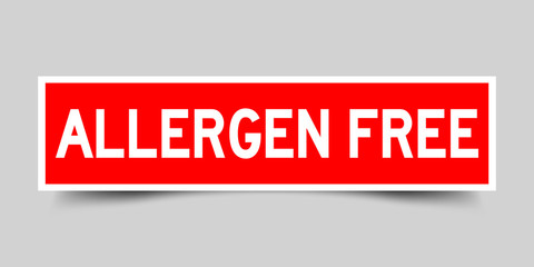 Label sticker red color in word allergen free on gray background