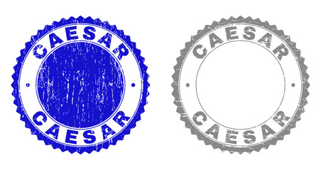 Grunge CAESAR stamp seals isolated on a white background. Rosette seals with grunge texture in blue and gray colors. Vector rubber watermark of CAESAR tag inside round rosette.