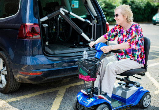 Senior Woman On An Electric Wheelchair