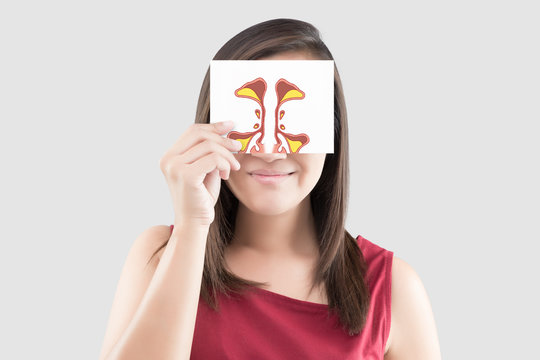 Smiling woman hold sinus picture on white paper on the gray background, Portrait of beautiful woman in the red shirt holding paper in her hand against the gray background