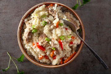 Pilaf stew made from rice, chicken meat, carrot and onion