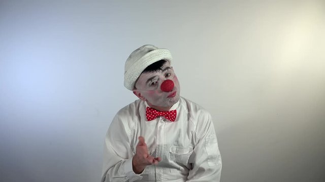 Emoji Clown. A serious clown gesticulates "not too good" and "so-so".