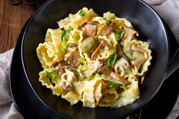 spicy roasted meat with mushroom sauce in the oven