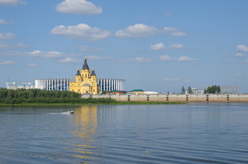 Summer view from the Nizhnevolzhskaya embankment to the Arrow and Alexander Nevsky Cathedral. The...
