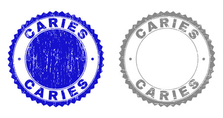 Grunge CARIES stamp seals isolated on a white background. Rosette seals with grunge texture in blue and grey colors. Vector rubber imitation of CARIES label inside round rosette.