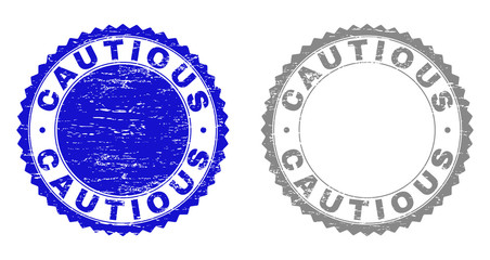 Grunge CAUTIOUS stamp seals isolated on a white background. Rosette seals with grunge texture in blue and gray colors. Vector rubber imitation of CAUTIOUS caption inside round rosette.