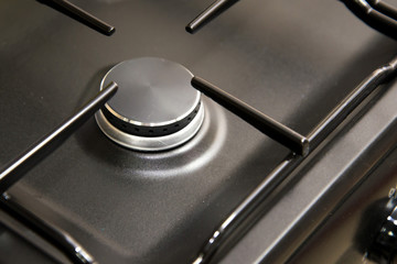 Gas burner new stove. Close-up.