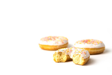 Bitten fresh tasty donut on a white background. Bakery concept, fresh pastries, delicious breakfast.