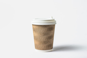 Paper cup with a protective lid on a white background. Concept coffee or tea to go, fast food, morning coffee, breakfast.